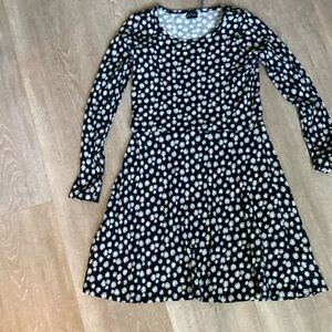 This is a black daisy, long sleeve dress